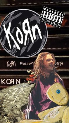 a man with dreadlocks standing in front of a building and the words korn written on it