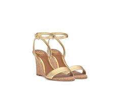 Vince Camuto Jefany - Women's Sandals : True Gold : Redefine elegance with every step by wearing the Vince Camuto Jefany, where minimalism meets sophistication. This dress wedge boasts a sculpted silhouette, creating the illusion of a sleek stiletto from behind. Its single band toe strap and almond-shaped open toe add chic simplicity, while the angled sling and bracelet straps with adjustable buckle ensure a secure fit. Leather upper. Polyester lining. Synthetic insole. Rubber outsole. Measurements: Heel Height: 3 2 5 in Weight: 1 lb 14.4 oz Product measurements were taken using size 5, width M. Please note that measurements may vary by size. Elegant Summer Wedge Sandals With Single Toe Strap, Elegant Gold Wedge Sandals With Wrapped Heel, Luxury Gold Wedge Sandals For Spring, Elegant Sandals With Wedge Heel And Removable Insole, Elegant Summer Wedge Sandals, Elegant Wedge Sandals With Wrapped Heel, Formal Wedge Sandals With Single Toe Strap For Spring, Elegant Wedge Heel Sandals With Wrapped Heel, Formal Spring Wedge Sandals With Single Toe Strap