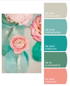 some pink flowers are in a vase with blue and green paint swatches on it