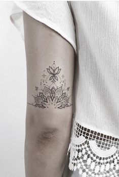 a woman with a tattoo on her arm