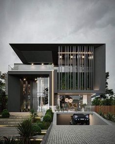 a car is parked in front of a modern house with stairs leading up to it