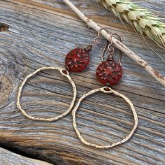 Gold Plated Hammered Hoop Earrings with a Red Czech Glass Flower. Includes Nickel Free Ear Wires. These earrings are light weight, comfortable, simple and fun. Throw them on with any outfit and they will definitely add some pop! They are approximately 2.75 inches in length and 1.25 inches at the widest portion. If you would like these in a different color or size, please let me know as I also do custom orders. To view more of my original jewelry designs, visit: https://www.etsy.com/shop/TheBeadC Bohemian Brass Earrings In Rust Color, Bohemian Rust Brass Earrings, Handmade Adjustable Rust Earrings, Bohemian Nickel-free Rust Earrings, Bohemian Rust-colored Nickel-free Earrings, Rust Color Dangle Earrings With Ear Wire, Rust Dangle Earrings With Ear Wire, Rust Bohemian Earrings For Pierced Ears, Bohemian Rust Earrings With Ear Wire