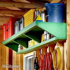 the shelves are filled with various tools and other things to use in this garage storage area