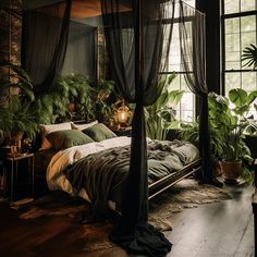 a bed sitting in a bedroom next to a window with plants on top of it