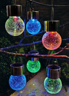 an advertisement for ebay's christmas lights in front of a tree with colorful balls hanging from it