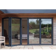 an open patio with sliding glass doors on the outside