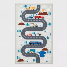 a white wall hanging with cars and trucks on it's sides in the shape of a road