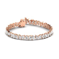 The multi-shaped diamond tennis bracelet is handcrafted in 14K or 18K yellow, rose, or white gold, and round, brilliant-cut white diamonds. A beautiful bracelet with timeless appeal that can be worn anywhere. It makes the perfect gift for yourself or someone you love, because diamonds are always forever. 14K or 18K gold 14.19 ct diamonds 45 white diamonds D-E-F color heart diamonds (all colors and grades available upon request) Diamond clarity is VVS-VS Secure insert clasp with safety link for safety, diamonds continuous on clasp Available in Yellow Gold, Rose Gold and White Gold Made with love in Los Angeles Complimentary gift wrapping provided Made to order depending upon size of diamonds desired and design. Most custom multi-shape tennis bracelets can be fabricated within 2-3 days, with Halo Band, Bezel Set Earrings, Signature Bracelet, Always Forever, Diamond Stacks, Bridal Diamond Jewellery, Color Heart, Bridal Bands, Diamond Charm