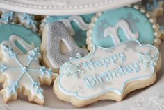 decorated cookies with frosting and icing on a plate