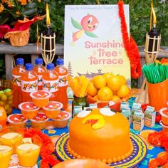 a table topped with lots of oranges and drinks