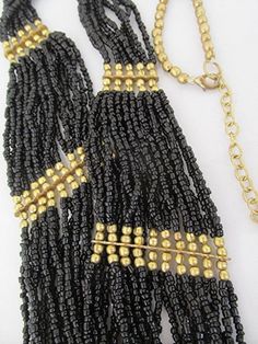 "Bib necklace seed bead necklace black seed bead flapper necklace vintage bead necklace Gatsby style Art Deco vintage 90s. This is an awesomely spectacular necklace hung with a mass of black glass seed beads and beautiful antique look gold tone beads. This high quality piece of jewelry which has a totally cool retro 1920s feel is in very good condition. A real attention grabber and extremely flattering; a real winner at your next Gatsby party.  Make sure to check out all the photos. Length of th Black Gold Necklace, Gray Beaded Necklace, Minimalist Necklace Silver, Black Necklace Statement, Deco Beads, Flapper Necklace, Gatsby Style, Style Art Deco, Vintage Choker