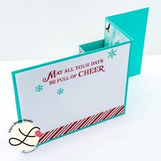 a close up of a greeting card in a box with a snowflake theme