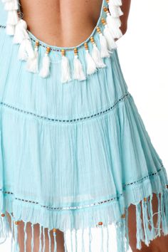 "Pretty low back dress in refreshing Santorini blue. Adjustable ties with tassels at shoulders. Tassels and beads details in the back and at the bottom trims. Available in S, M and L Size S: Width 17\" lay flat ** In stock. Ship immediately via USPS First Class Mail from Las Vegas (2-3 business days, not including one day handling time)." Summer Backless Dress With Fringe, Sleeveless Beaded Fringe Mini Dress For Summer, Light Blue Tie Back Mini Dress For Beach, Turquoise Bohemian Mini Dress For Summer, Blue Tie-back Dress For Beach Cover-up, Blue Tie-back Dress For Beach, Blue Tie Back Dress For Beach Cover-up, Blue Tie Back Dress For Beach, Spring Beach Dress With Beaded Fringe