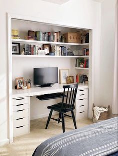 a bedroom with a bed, desk and bookshelf in the corner is shown