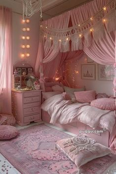 a bedroom with pink walls, curtains and lights on the ceiling is decorated in pastel colors