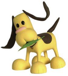 a yellow toy dog with a green leaf in its mouth and tongue sticking out from it's mouth