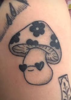 a tattoo with a mushroom on it