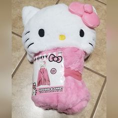 a hello kitty stuffed animal is on the floor