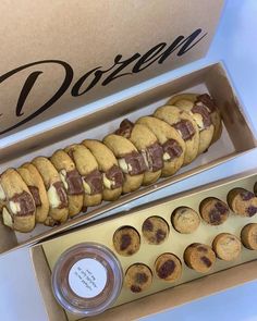 a box filled with chocolate chip cookies next to an open box