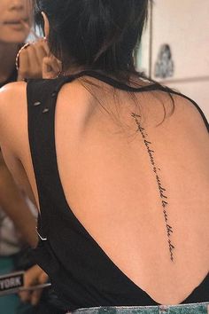 a woman with a tattoo on her back