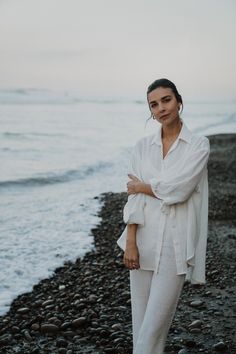 The Lilo Shirt is a timeless classic, crafted from lightweight fabric with a captivating texture reminiscent of rippled water. Whether you're unwinding at home or embarking on a beach trip, you can effortlessly style it as a sleep dress, an oversized blouse, or a breezy cover-up. Oversized fit Drop shoulder Button up High-low hemline Semi-sheer Runs large Rippled Water, Shirt Linen, Travel Capsule, Travel Capsule Wardrobe, Oversized Blouse, Sleep Dress, Beach Covers, Relaxed Style, Oversized Shirt