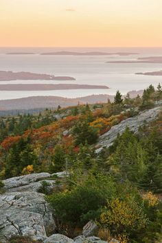 the sun is setting on an autumn day in the mountains above lake ontario, canada