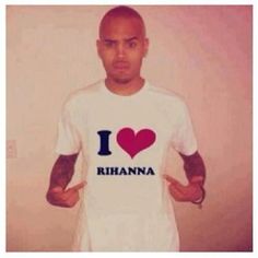 a man wearing a t - shirt with the word i love rihanna on it