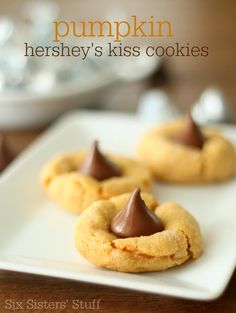 pumpkin hershey's kiss cookies on a white plate with the title overlay