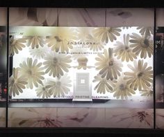 a display window with flowers on it