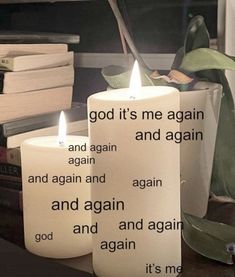 two white candles with the words god it's me again and again