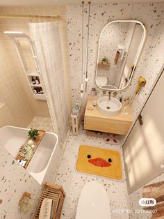 a bathroom with a yellow duck rug on the floor