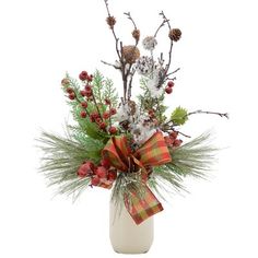 a white vase filled with flowers and greenery