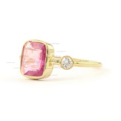 Description Natural Pink Tourmaline Ring, Solid 14K Yellow Gold Ring, Diamond Engagement Ring, October Birthstone Ring, Handmade Ring, Womens Ring ≫ Features * Items Code: SPBR00434/SGR01865 * Solid 14K Yellow Gold with stamped * 18K also available - Additional fees may apply) * More options in gold color: Rose, yellow, White gold * Diamonds Wt: 0.07 Ct. * Diamond color: G-H * Diamonds Clarity: SI * Diamonds Cut: Brilliant * Pink Tourmaline Weight:- 1.34 Ct. * Ring Size 3 to 10 (As per your requ Pink Ruby Ring With Bezel Setting In 14k Gold, Pink Ruby Gemstone Ring In 14k Gold, Pink Ruby Ring With 14k Gold, Fine Jewelry Pink Ring With Bezel Setting, Pink Emerald Ring Fine Jewelry, Pink Sapphire Ring In 14k Gold With Bezel Setting, Pink Sapphire Ring With Bezel Setting In 14k Gold, 14k Gold Pink Sapphire Ring With Bezel Setting, Pink Tourmaline Birthstone Ring