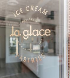 an ice cream shop window with the words la glace written on it