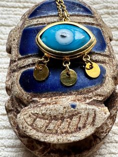 "925 Sterling Silver 24 Karat Yellow Gold plated necklace with a blue Evil Eye. 44cm long with a 4cm extension. Gold Vermeil jewelry is best kept, when not in contact with salt water, shampoos, perfumes or body oils. EVIL EYE  Nasar Boncu known as \"mati\" (μάτι) in Greek culture, is a curse thought to be given by a malicious glare that can cause bad luck or loss. You may have heard someone giving you the \"evil eye\" from across the room - and many people around the world believe this to be mor Blue Evil Eye Necklace, Eye Symbol, Greek Culture, Gold Vermeil Jewelry, Body Oils, Hippie Necklace, Bad Luck, Blue Evil Eye, Vermeil Jewelry