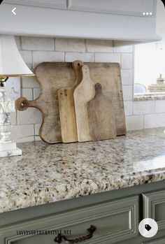 a kitchen counter with cutting boards on it