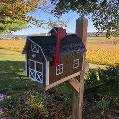 a mailbox in the shape of a house