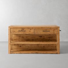 a wooden dresser sitting on top of a white floor