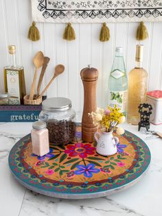 the kitchen counter is covered with various items such as spices, salt and pepper shakers