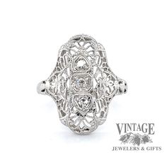 Vintage filigree 18k white gold and diamond ring Diamond White Filigree Ring In Fine Jewelry Style, White Diamond Ring With Filigree, Diamond White Filigree Rings Fine Jewelry, 14k White Gold Diamond Ring With Filigree, Heirloom White Filigree Ring With Brilliant Cut, Vintage White Diamond Filigree Ring, Diamond White Filigree Platinum Diamond Ring, Antique White Diamond Filigree Ring, Ornate Brilliant Cut Diamond Ring