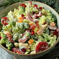 a bowl filled with broccoli, radishes and cranberry salad