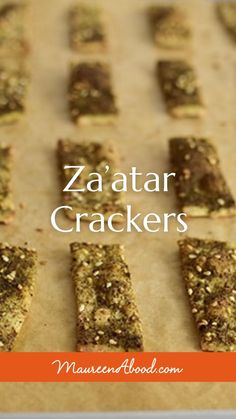 some crackers are on a baking sheet with the words za'atar crackers