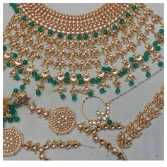 Indian Bridal Kundan Wedding Choker Necklace, Earrings, Matha Patti, Nose ring, Haath Phool Jewelry  Set for Women This product is Imittion  & hence the product can be non-uniform & vary in color & texture. Color : Sea-Green Gorgeous Kundan Designer  Zircon Gold Plated Necklace jewelry Set 1.Set consists of Necklace, Earrings, Maang Tikka Set 2. Necklace Size:(5"L X 6.5"W) 3.Necklace Weight: 135 Gm 4.Earrings Length:3.5" 5.Tikka Length: 5.5" OCCASION::- Gracefully Necklace Jewelry pair with Desi Bollywood Style Green Jewelry Sets For Wedding, Desi Wedding Jewelry, Bollywood Style Green Bridal Necklace With Cutdana, Bollywood Green Jewelry Sets For Wedding, Traditional Green Bridal Necklace For Eid, Handmade Green Bollywood Bridal Necklace, Haath Phool, Wedding Choker Necklace, Maang Tikka Set