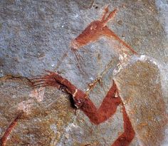 a rock painting with a horse on it