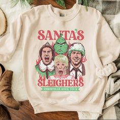 Santa’s Sleighers Christmas Rock Tour. Bought On Etsy. Brand New, Never Worn. Elf Home, Hoodie Art, Home Alone Christmas, Felt Beads, Christmas Rock, Funny Christmas Sweaters, Santa Shirts, Home Alone, Christmas Vacation