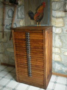 a wooden cabinet with two roosters in it