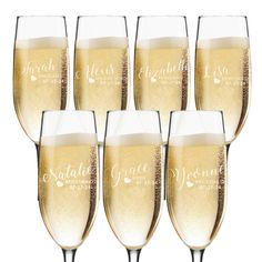 six champagne glasses filled with sparkling wine