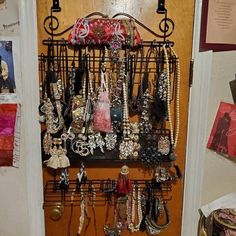 a bunch of jewelry hanging on a wall