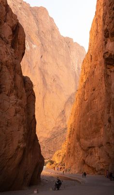 people are walking through the narrow canyons in wadih