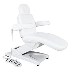 a white electric reclining chair sitting on top of a table